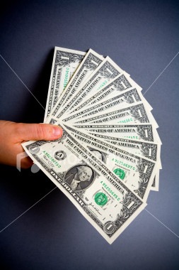 [ist2_1332157-hand-full-dollars[2].jpg]