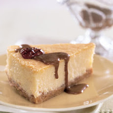 Mascarpone Cheesecake with Candied Pecans and Dulce de Leche Sauce