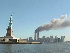 [240px-National_Park_Service_9-11_Statue_of_Liberty_and_WTC_fire[2].jpg]