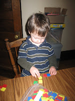 Erik enjoying the math tiles