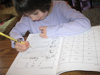 Madeline with her new phonics book