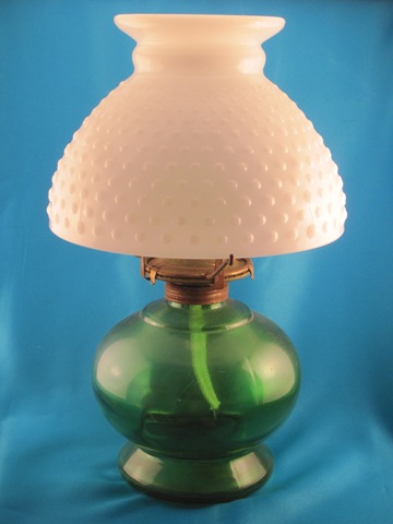 green and white oil lamp