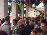 People waiting for the rain to stop during the festivals of Burgos.
