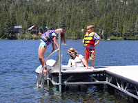 July 4th 2006 - 11 — 4th of July at cabin.  The year we went to Squaw Valley to watch fireworks for the first time. Emily, Lisa and Patrick on the dock.