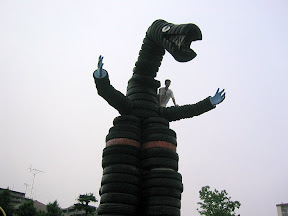 Kai took this picture of me on the tire dinosaur