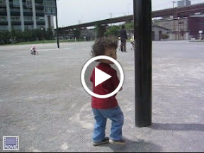 Eidan pretending to crash into posts, at the park adjacent to World City Towers in Shinagawa Eidan pretending to crash into posts, at the park adjacent to World City Towers in Shinagawa