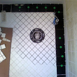 Setting the new tiles. They blended in nicely with the existing tiles Setting the new tiles. They blended in nicely with the existing tiles