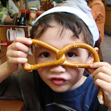 Eidan with a pretzel at a pub in Prague