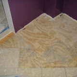 There used to be a base cabinet here, with no tile under it. I removed the tiles that were cut to go around it, and then marked the locations for the new tiles