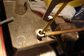 A piece of the shower head pipe was left behind in the wall pipe, so I had to get it out without damaging the threads. I cut about halfway into it in several spots with a hacksaw blade