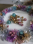 The finishing touch on the foil wreaths