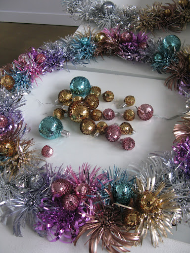 The finishing touch on the foil wreaths