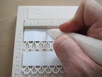 I then turned the strip over and scored every four loops, starting two loops in from the first score. This created opposite scores every two loops...