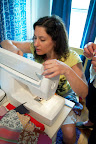 Sara learns to thread the Viking machine. Sara learns to thread the Viking machine.