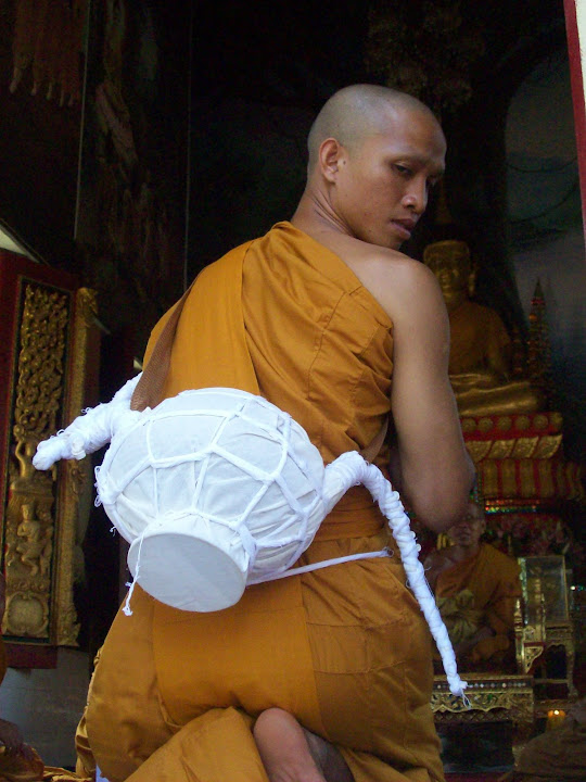 Prayoon with a Thai Naga symbol on his back near the end of the ceremoony Prayoon,Yoon,monk