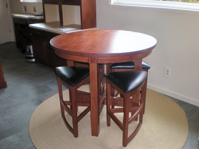 42 Inch Diameter Barcelona Table Shown in Chocolate Cherry, Shown with Barcelona Barstools