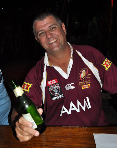 QLD 26/5/10-Fans watch State of Origin on a jumbo screen at Calypso Backpackers Resort in Cairns, QLD. Photo by Bobbi Lee Hitchon