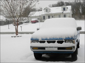 John's truck covered in snow.