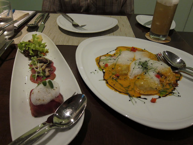 Carpaccio with foie gras and duck confit ravioli