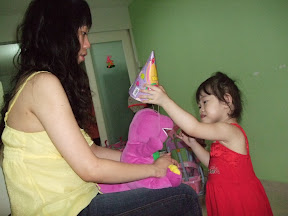 Nico wearing birthday hat for Barney