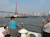 Family taking picture with the Nanpu Bridge in the background
