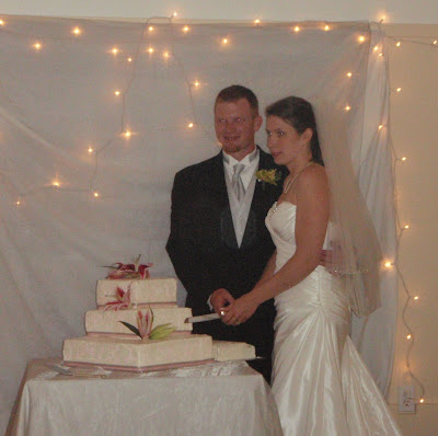 Stephen and Bianca cutting the cake