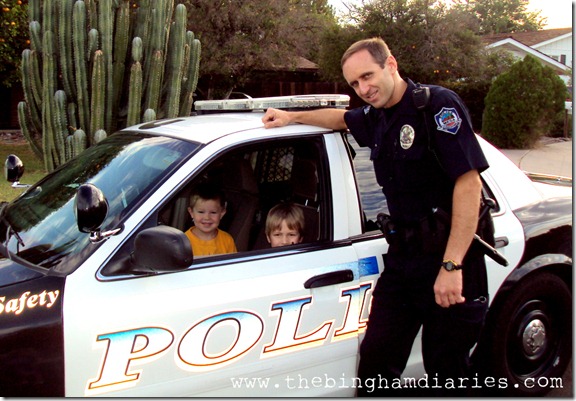 boys in police car