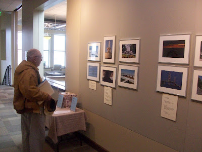 A patron at the Washington Public Library looks at the "Great Lakes Region" Photo Exhibit now on display in the Helen Wilson Gallery - KCII News A patron at the Washington Public Library looks at the "Great Lakes Region" Photo Exhibit now on display in the Helen Wilson Gallery - KCII News