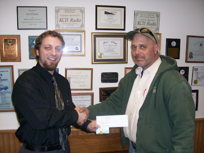 General Manager Joe Nichols and Jeff Yoder of Washington, the KCII Live Free For A Month/Radio Active Bingo Grand Prize Winner (KCII Radio) General Manager Joe Nichols and Jeff Yoder of Washington, the KCII Live Free For A Month/Radio Active Bingo Grand Prize Winner (KCII Radio)
