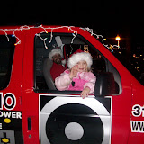 Emma Nichols waves to the KCII news team as dad and KCII General Manager Joe Nichols pilots the Big Red Radio through Washington's 15 annual Lighted Holiday Parade (KCII NEWS)