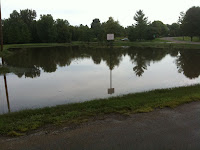 Flood Waters Surged South Into Sunset Park This Morning, But Waters Have Now Receded Into A Field On The North Side Of West Main Street.<br />
(KCII's Chance Dorland)
