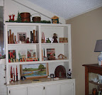 More Christmas items on the second bookshelf. If you look closely you can see the shelf with Tavern and Gurley Candles. Tavern Novelty candles were made by the Socony Vacuum Oil Company in the 1930's and 40's era. Tavern candles were made before the 1950's Gurley Novelty candles that are so popular for collectors. Also, notice the old license plate behind the angel. While the plate is decidedly non-festive, it does represent Missiouri which is where much of Chris' family lives now and where she lived before moving to Texas.