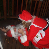 Mrs Clause Tends to Santa