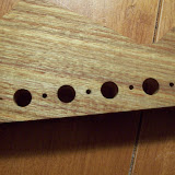 This was actually pretty easy, but taking my time was key.  The tuners came with a guide that helped line up the holes.  I used a center punch to mark and then double-checked with a tuner before drilling.  I also marked the depth for the holes on the drill bit with a sharpie.  I used the 2.4mm bit and made a shallow hole before checking alignment one more time with a tuner.  Then I rolled the bit around carefully to get the extra .3mm.  The tuners fit perfectly.