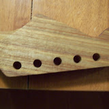 Here we have the headstock before I started.  These holes were pre-drilled for Sperzel tuners by Warmoth.  Sorry it is out of focus.