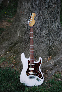 My finished Mary Kaye Warmoth strat guitar.  Actually not quite finished. I wanted to snap these before sundown, but afterwards I installed the strap buttons and intonated it.
