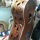 This is their vine "concept" guitar. Redwood Top, Black Acacia Back and Sides. Check the maple binding and it's inside the guitar, too.