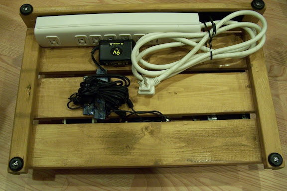Underside, showing the mounted power strip (I used velcro), and the One Spot for power.