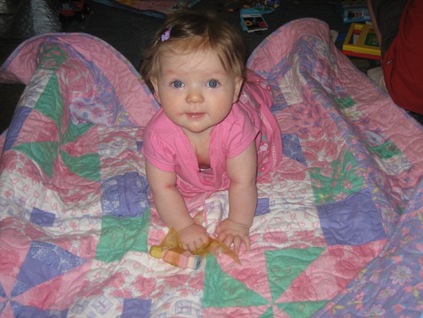 Abigail on her quilt