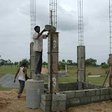 Umapati pours masala into the first pillar