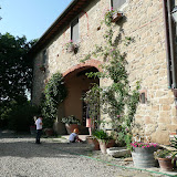 The American owners kids playing in front of the wine tasting garage at Montecalvi wine farm.