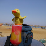 Duckee sipping a relaxing cocktail in the sun
