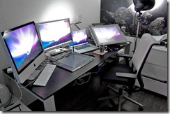 A set of tablets and PCs on a desk 
