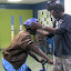 Shawn fits Keyon for a helmet