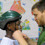 Marc helps Ya'sier with his helmet