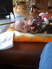Just hanging out at home, watching Audrey watch her hand. I think that's my knee in the lower right corner.