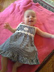 Another picture of Audrey in her sun dress. You'll notice it has a daisy on it and I bought the matching hat as well.
