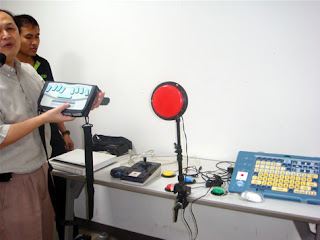 Day 3 - A Thai Visually Impaired resource person explains the different assistive devices used by PWDs in accessing the computer.