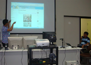 Day 10 - Sir Edmond explains his Joomla designed website in sign language while Sir Jojo reverse interprets.