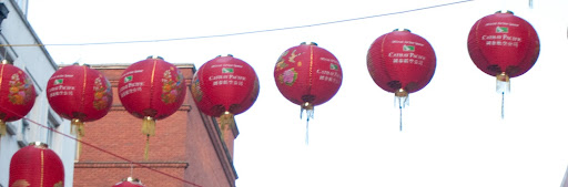a group of red lanterns on a building